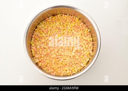 Arhar and makla dal in steel bowl isolated on white background Stock Photo