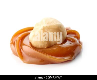 hazelnut in melted caramel macro isolated on white background Stock Photo