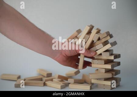 Board game jenga tower of light wood sticks Stock Photo