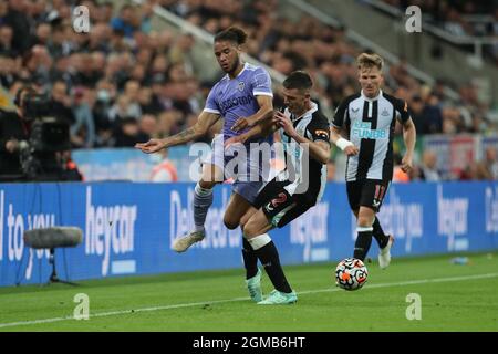 NEWCASTLE UPON TYNE. SEPT 17TH Leeds United's Tyler Roberts in action with Newcastle United's Ciaran Clark during the Premier League match between Newcastle United and Leeds United at St. James's Park, Newcastle on Friday 17th September 2021. Stock Photo