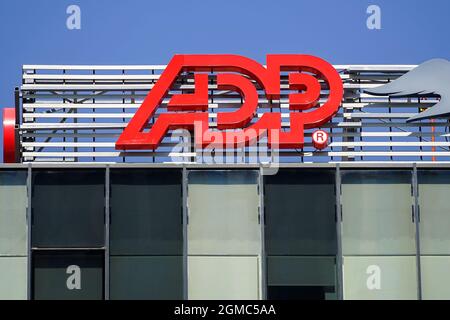 Bucharest, Romania - August 16, 2021: The logo of the American provider of human resources management software and services ADP is seen on top of Gara Stock Photo