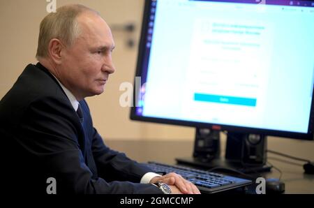 Novo-Ogaryovo, Russia. 17th Sep, 2021. Russian President Vladimir Putin uses online voting to cast his ballot in the Russian parliamentary elections from his home at the Novo-Ogaryov state residence September 17, 2021 outside Moscow, Russia. Credit: Alexei Druzhinin/Kremlin Pool/Alamy Live News Stock Photo