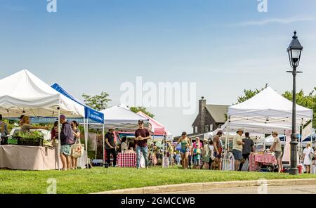 People at a Sag Harbor Farmers market on a summer day Stock Photo