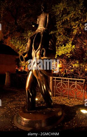 Sculpture brass statue of Franz Kafka on Dusni and Vezenska street for Czechia people and foreign travelers travel visit in Jewish Quarter at Praha ci Stock Photo