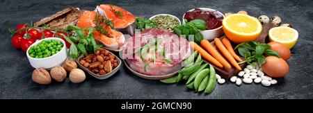 Food high in vitamin B3 on dark background. Healthy diet concept. Panorama Stock Photo