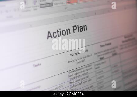 Shot of an excel sheet on computer screen showing business action plan table Stock Photo