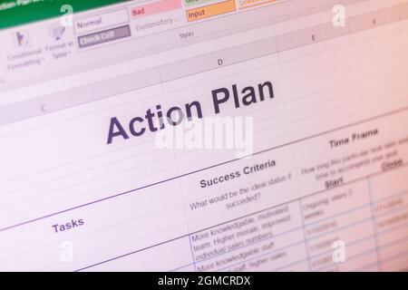 Shot of an excel sheet on computer screen showing business action plan table. Stock Photo