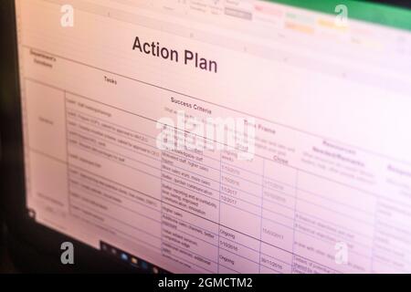Shot of an excel sheet on computer screen showing business action plan table. Stock Photo