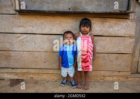 Young embera indian boy and girl in the La Bonga village beside Rio Pequeni, Chagres national park, Republic of Panama, Central America. Stock Photo