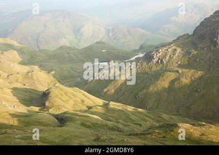 Bright Beck and Stickle Tarn above Langdale seen from Sergeant Man in the English Lake District, UK Stock Photo