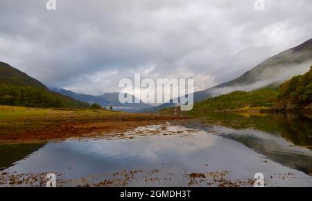 Scotland. 18th Sep, 2021. 18th September 2021 Loch Leven, Scotland, uk. Weather. A view looking at the still inversion water of loch Leven in the Scottish Highlands. Credit: phil wilkinson/Alamy Live News Stock Photo