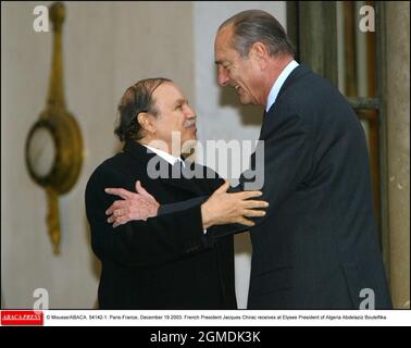 © Mousse/ABACA. 54142-1. Paris-France, December 19 2003. French President Jacques Chirac receives at Elysee President of Algeria Abdelaziz Bouteflika. Stock Photo