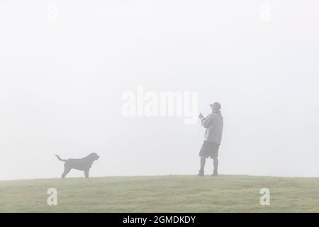 UK, Weather.  18th September 2021. Misty start to the day for people out exercising  their dogs in Abington Park, Northampton. Credit: Keith J Smith./Alamy Live News. Stock Photo