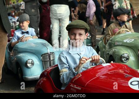 Goodwood, West Sussex, UK. 18th September 2021. Luca Mason-Franchitti grandson of Pink Floyd drummer Nick Mason prepares for the Settrington Cup Austin J40 pedal car race at the Goodwood Revival in Goodwood, West Sussex, UK. © Malcolm Greig/Alamy Live News Stock Photo