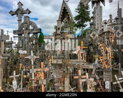 The Hill of Crosses - a site of pilgrimage in northern Lithuania. Over the generations, crosses, crucifixes, statues of the Virgin Mary and thousands Stock Photo