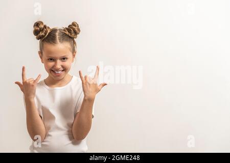 a girl with dark hair to make confidence on a light background Stock Photo