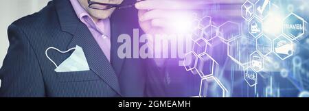 A disposable medical mask sticks out of a pocket instead napkin. A man with a disposable mask in a suit and jeans. Individual respiratory protection. Stock Photo
