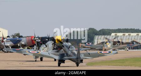 IWM Duxford, Cambridgeshire, UK. 18 September 2021. Flying display begins at The Battle of Britain Air Show on the former RAF site that played a central role as a base for many Spitfire and Hurricane pilots during the Second World War, with, appropriately, various marques of Spitfires and Hurricanes. Credit: Malcolm Park/Alamy Live News Stock Photo