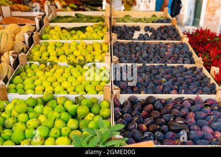 Fresh figs on the market shelves. Street market in Italy. Traditional mediterranian food Stock Photo