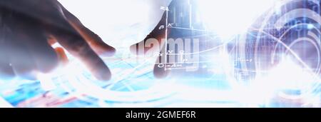 Business concept. Information technology and data processing. Hands over the screen graphic data. A modern software product in business. Stock Photo
