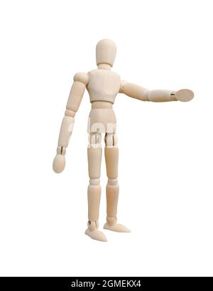 Wooden puppet standing and pointing his hand to the left. A Standing wooden dummy isolated on white background Stock Photo