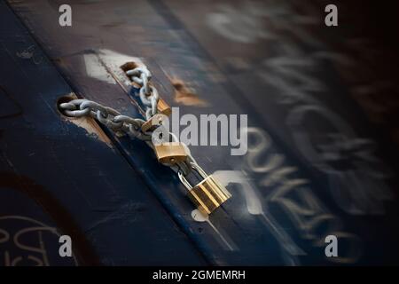 Chain and padlock on an old wooden door Stock Photo
