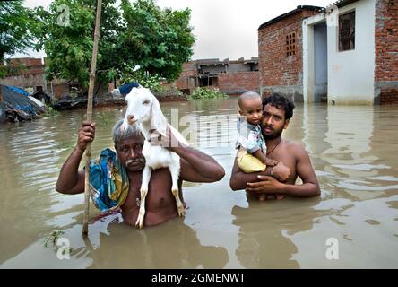 The rural village people are homeless due to destructive flood and water logged at Varanasi, Uttarpradesh in India during the year 2013. Stock Photo