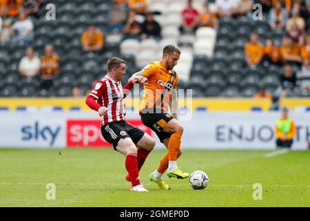 Hull, UK. 18th Sep, 2021. John Fleck #4 of Sheffield United and George Moncur #18 of Hull City in Hull, United Kingdom on 9/18/2021. (Photo by Ben Early/News Images/Sipa USA) Credit: Sipa USA/Alamy Live News Stock Photo