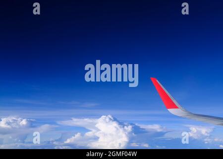 red winglet in graduated dark blue sky Stock Photo