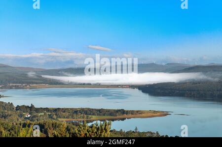 DORNOCH FIRTH SCOTLAND VIEW FROM STRUIE HILL LOOKING TOWARDS  BONAR BRIDGE IN LATE SUMMER WITH HEAVY MORNING MIST Stock Photo