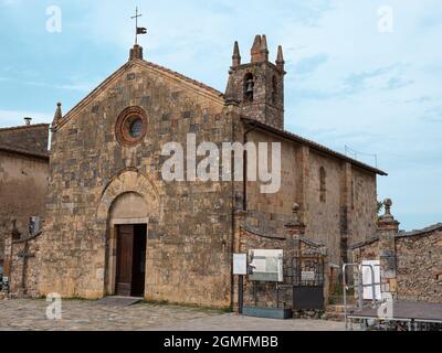 Church of Santa Maria Assunta in Piazza Roma in Monteriggioni, Siena - Italy. Stock Photo