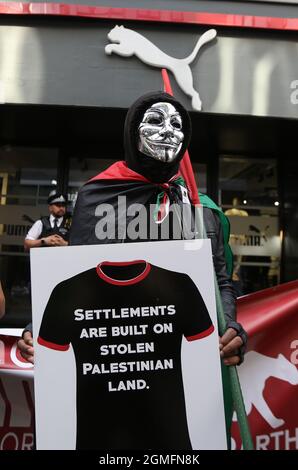 London, England, UK. 18th Sep, 2021. Pro-Palestine protesters stage a demonstration outside Carnaby Street branch of sportswear brand Puma in London. Protesters call for a boycott of the company's products claiming by its sponsorship of Israeli Football Association it supports occupation of Palestinian soli. (Credit Image: © Tayfun Salci/ZUMA Press Wire)