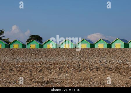 Colourful beach huts seen in Littlehampton, UK in the summer of 2021. Stock Photo
