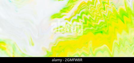 Abstract yellow-green liquid background. Green paint pattern with cyclical swirls. Trendy wallpaper. Eco concept Stock Photo