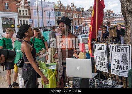 London, UK. 18th Sep 2021. Fight The Tower - a 20 stoey office block that no one wants in the centre of Brixton. Community groups in Brixton fighting gentrification come together for a rally in Windrush Square with music, speeches, actions and good food. They say Lambeth council is allowing developers to decide the future of Brixton with developments, such as the Hondo tower by Texan billionaire Taylor McWilliams, displacing communities and silencing their voices. Peter Marshall/Alamy Live News Stock Photo