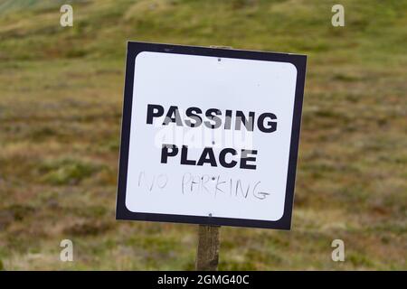 Passing Place sign with 'no parking' hand written underneath - Glen Lyon, Scotland, UK Stock Photo
