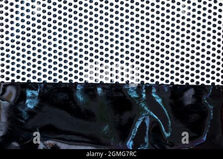 Fabric with dots pattern and lacquered leather as background Stock Photo