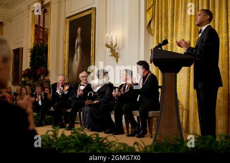 President Barack Obama applauds Kennedy Center Honors recipients during a reception in the East Room of the White House, Dec. 6, 2009.  (Official White House Photo by Pete Souza) This official White House photograph is being made available only for publication by news organizations and/or for personal use printing by the subject(s) of the photograph. The photograph may not be manipulated in any way and may not be used in commercial or political materials, advertisements, emails, products, promotions that in any way suggests approval or endorsement of the President, the First Family, or the Whi Stock Photo