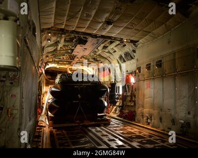 Inflatable boats are secured in a U.S. Air Force C-130J Super Hercules aircraft from Ramstein Air Base, Germany, in preparation to drop over the Zatoka Gdanska Bay, Poland, drop zone during Aviation Detachment Rotation 21-4, Sept. 17, 2021. U.S. Air Forces in Europe-Air Forces Africa’s forward presence with these training exercises allows us to build deeper operational ties with Poland and facilitates seamless integration of U.S. Air Force rotational forces. Stock Photo