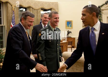 President Barack Obama meets with General Stanley McChrystal, Commander, International Security Assistance Force, U.S. Ambassador to Afghanistan Karl Eikenberry, and National Security Advisor General James Jones, in the Oval Office, Dec. 7, 2009.  (Official White House Photo by Pete Souza) This official White House photograph is being made available only for publication by news organizations and/or for personal use printing by the subject(s) of the photograph. The photograph may not be manipulated in any way and may not be used in commercial or political materials, advertisements, emails, prod Stock Photo