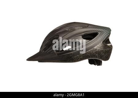 Black bicycle helmet in profile on a white background with a correction in the center of the photo Stock Photo
