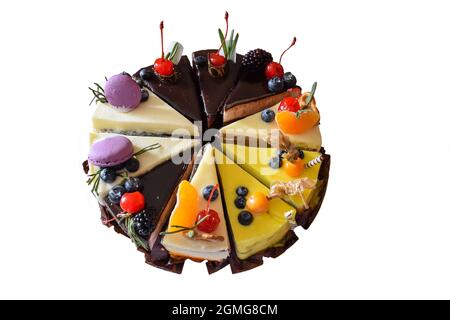 Sliced cake made from different types of separate pieces on a clean white background for correction Stock Photo
