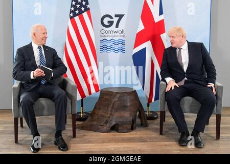 File photo dated 10/6//2021 of US President Joe Biden (left) with Prime Minister Boris Johnson, during their meeting at the G7 summit in Cornwall. Johnson is expected to push Biden on the looming humanitarian crisis in Afghanistan, the potential of reopening UK-US travel and climate change during a visit to the White House. Issue date: Saturday September 18, 2021. Stock Photo