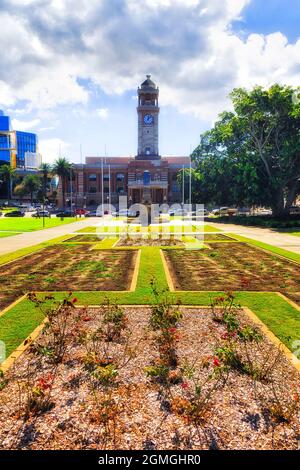 Townhall building in City of Newcastle on the city square with lawns and roses at midday of a sunny weather. Stock Photo
