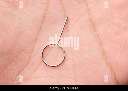 Sim Ejector Tool in Hand Stock Photo