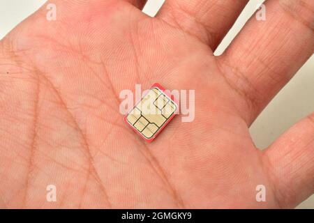 Close up image of sim card in hand Stock Photo