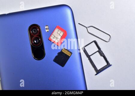 mobile with sim and ad card isolated on white background Stock Photo