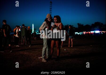 Chicago, USA. 18th Sep, 2021. Attendees look at a schedule during Riot Fest Music Festival on on Saturday September 18, 2021 in Chicago, IL. (Photo by Christopher Dilts/Sipa USA) Credit: Sipa USA/Alamy Live News Stock Photo