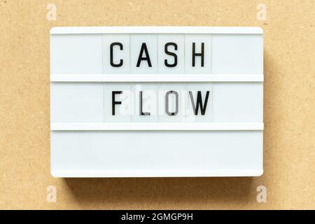 Lightbox with word cash flow on wood background Stock Photo