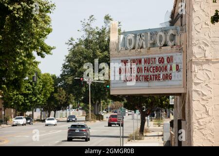 Lompoc, California, USA - July 25, 2021: Midday sun shines on the historic downtown Lompoc Theatre. Stock Photo